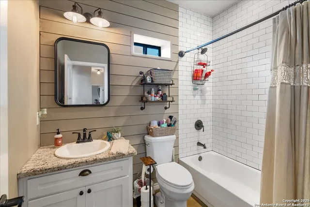 a bedroom with furniture and a window