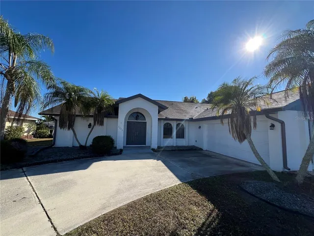 a view of house with yard outdoor seating and entertaining space