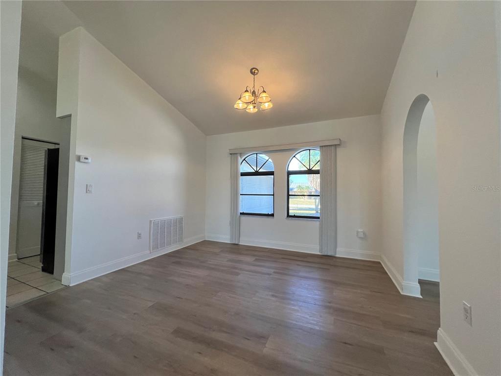 2092 Rio De Janeiro Avenue Punta Gorda, FL 33983 - Photo 15 of 50 wooden floor in an empty room with a window