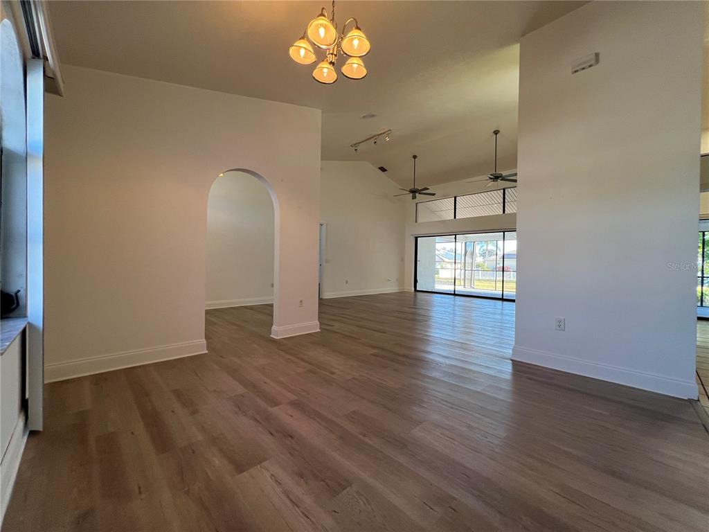 2092 Rio De Janeiro Avenue Punta Gorda, FL 33983 - Photo 16 of 50 an empty room with wooden floor and windows