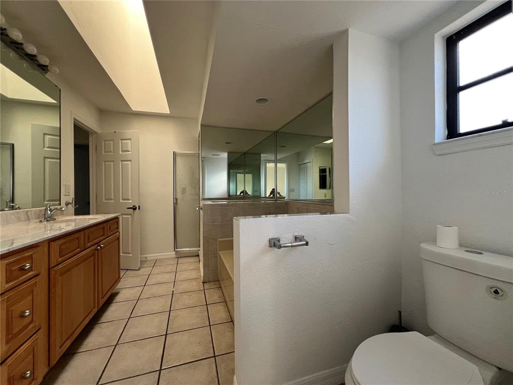 2092 Rio De Janeiro Avenue Punta Gorda, FL 33983 - Photo 30 of 50 a bathroom with a toilet sink and mirror