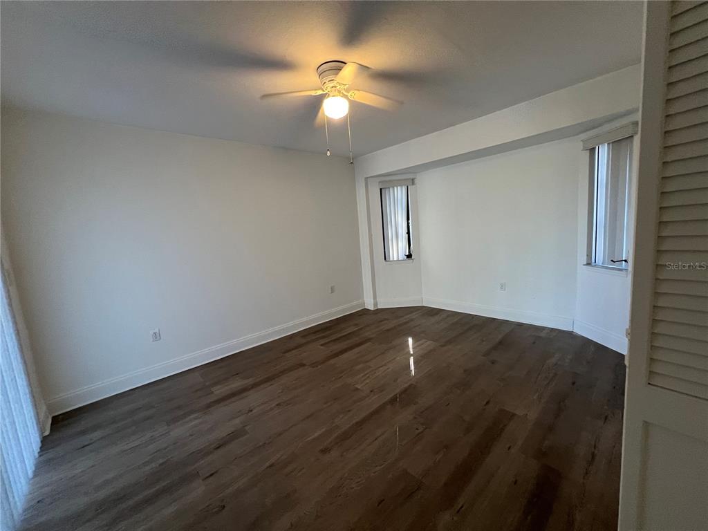2092 Rio De Janeiro Avenue Punta Gorda, FL 33983 - Photo 33 of 50 a view of empty room with wooden floor and fan
