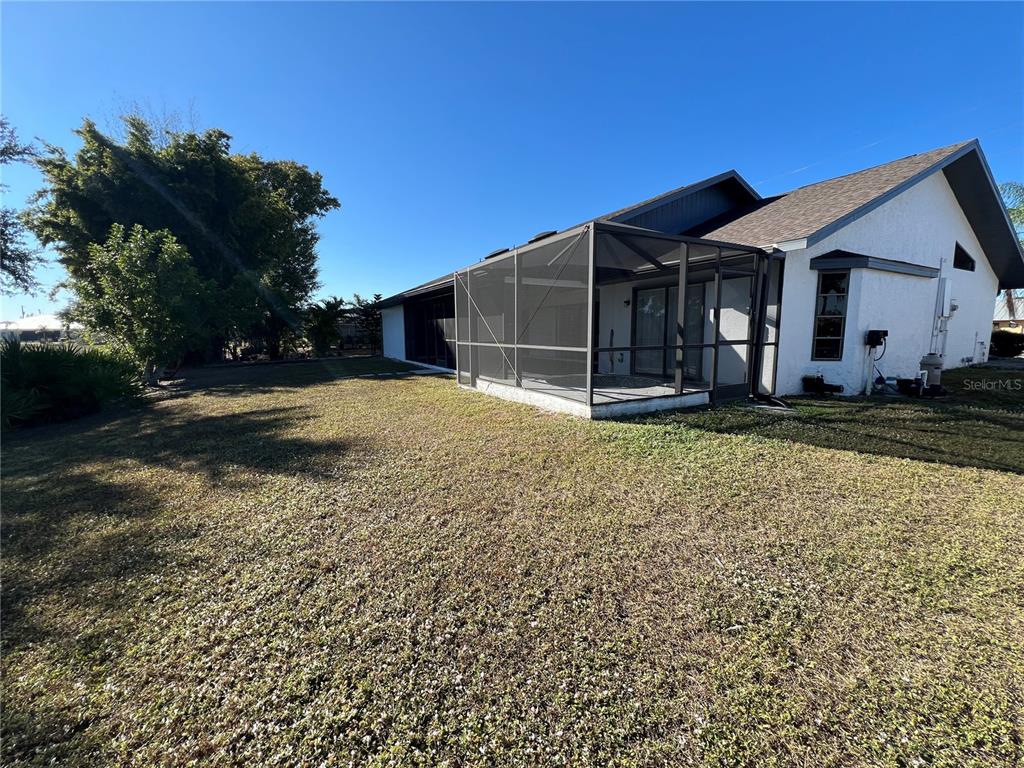 2092 Rio De Janeiro Avenue Punta Gorda, FL 33983 - Photo 50 of 50 a front view of a house with a yard