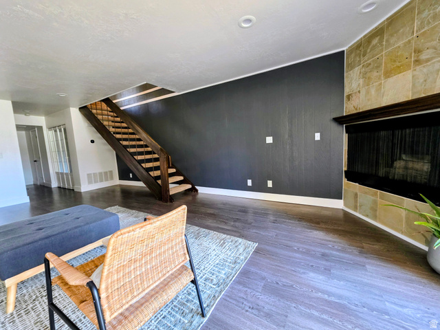 5265 South Rome Beauty Park Murray, UT 84123 - Photo 16 of 35 Living area with dark wood-style floors and wooden walls