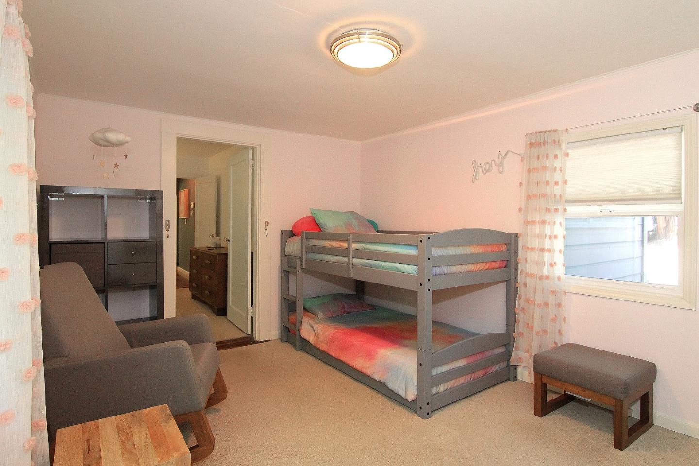 10990 Riverside Road Brookdale, CA 95005 - Photo 12 of 29 a bedroom with a bed and a chair