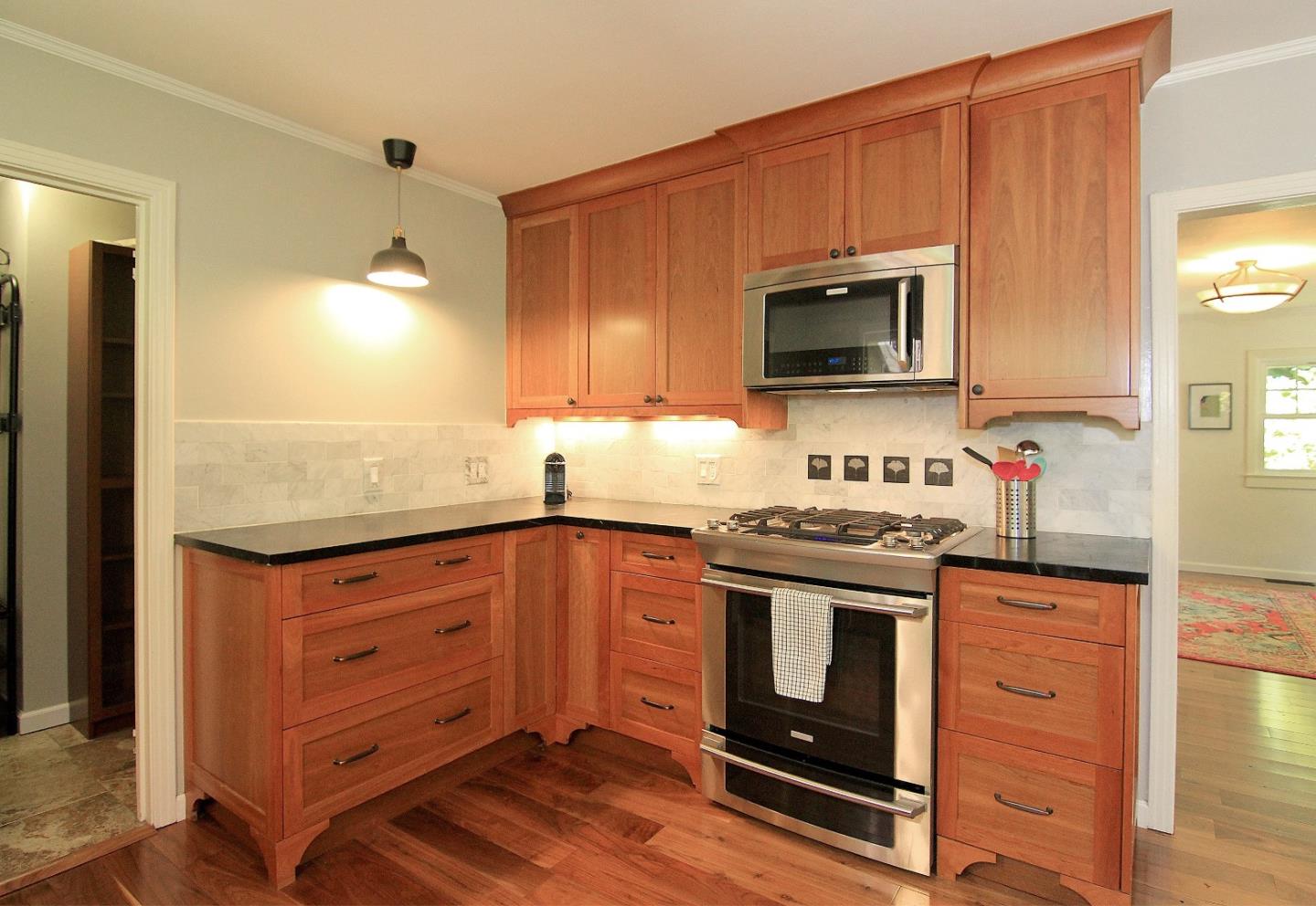 10990 Riverside Road Brookdale, CA 95005 - Photo 14 of 29 a kitchen with granite countertop wooden cabinets and stainless steel appliances