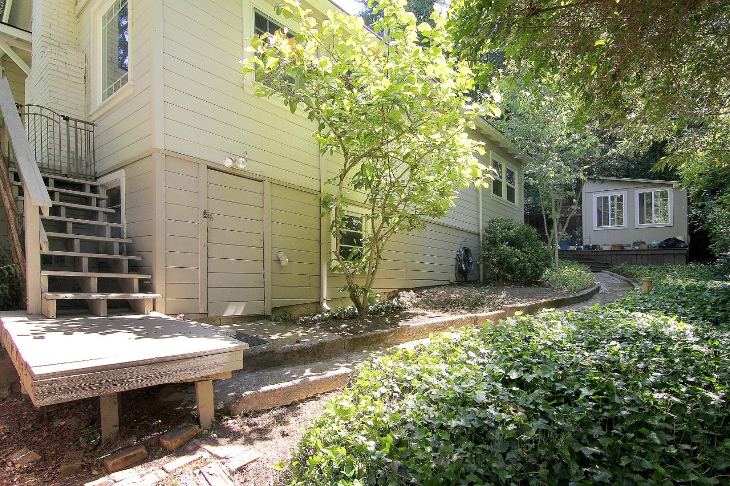 10990 Riverside Road Brookdale, CA 95005 - Photo 24 of 29 a view of a patio with table and chairs and potted plants