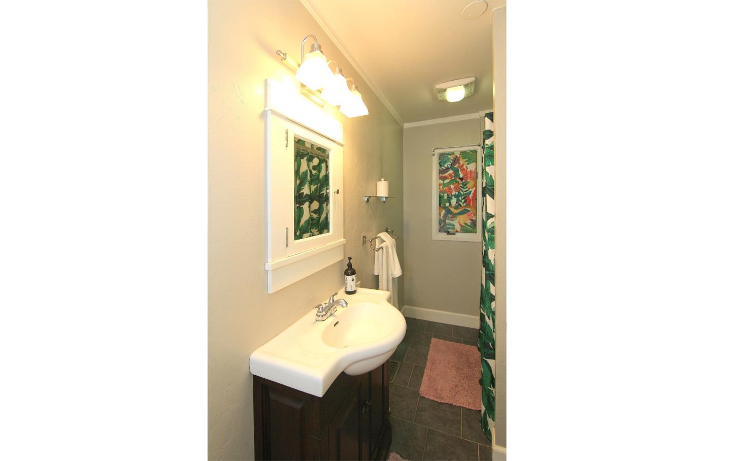 10990 Riverside Road Brookdale, CA 95005 - Photo 26 of 29 a bathroom with a sink and a mirror
