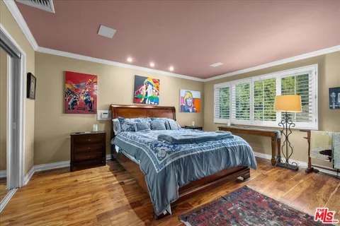 a bed room with a bed and a chair