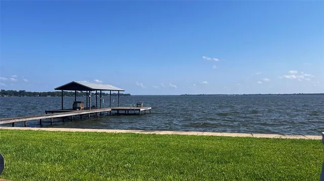 a view of a big house with a big yard