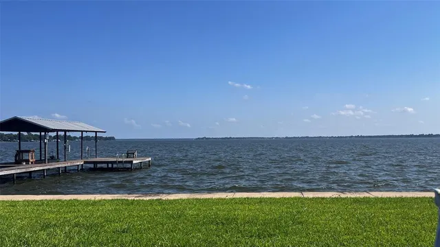 a view of a lake with a yard