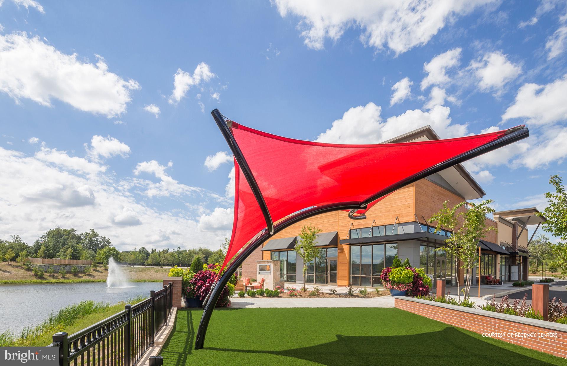 19868 Lavender Dust Square Ashburn, VA 20147 - Photo 18 of 22 a view of swimming pool outdoor seating and lake view