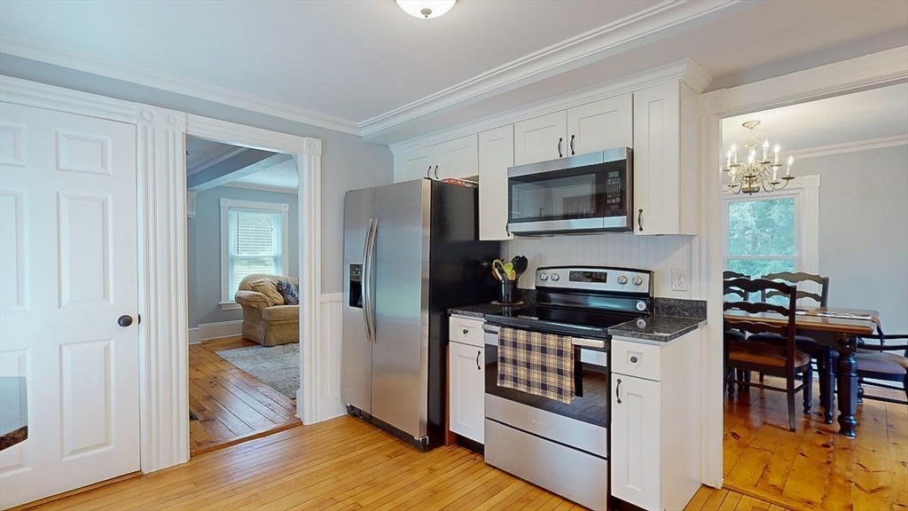 509 Mendon Road Sutton, MA 01590 - Photo 17 of 42 a kitchen with stainless steel appliances a stove microwave and refrigerator