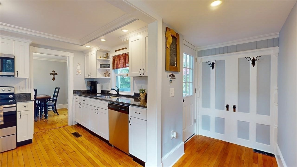 509 Mendon Road Sutton, MA 01590 - Photo 18 of 42 a kitchen with stainless steel appliances granite countertop a stove a sink and a refrigerator