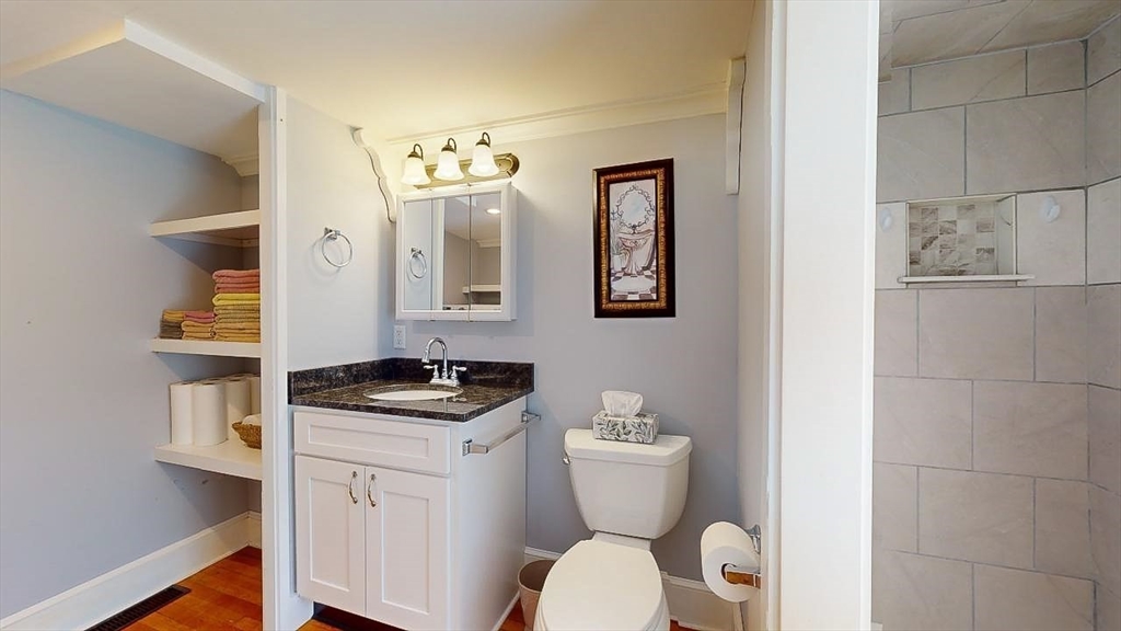 509 Mendon Road Sutton, MA 01590 - Photo 20 of 42 a bathroom with a granite countertop toilet and a sink