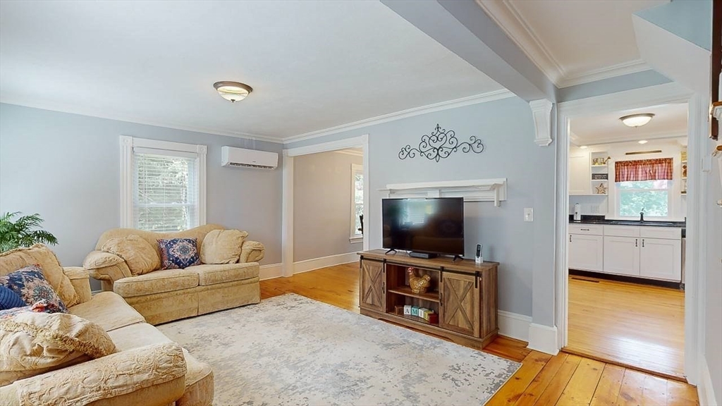 509 Mendon Road Sutton, MA 01590 - Photo 27 of 42 a living room with furniture and a flat screen tv