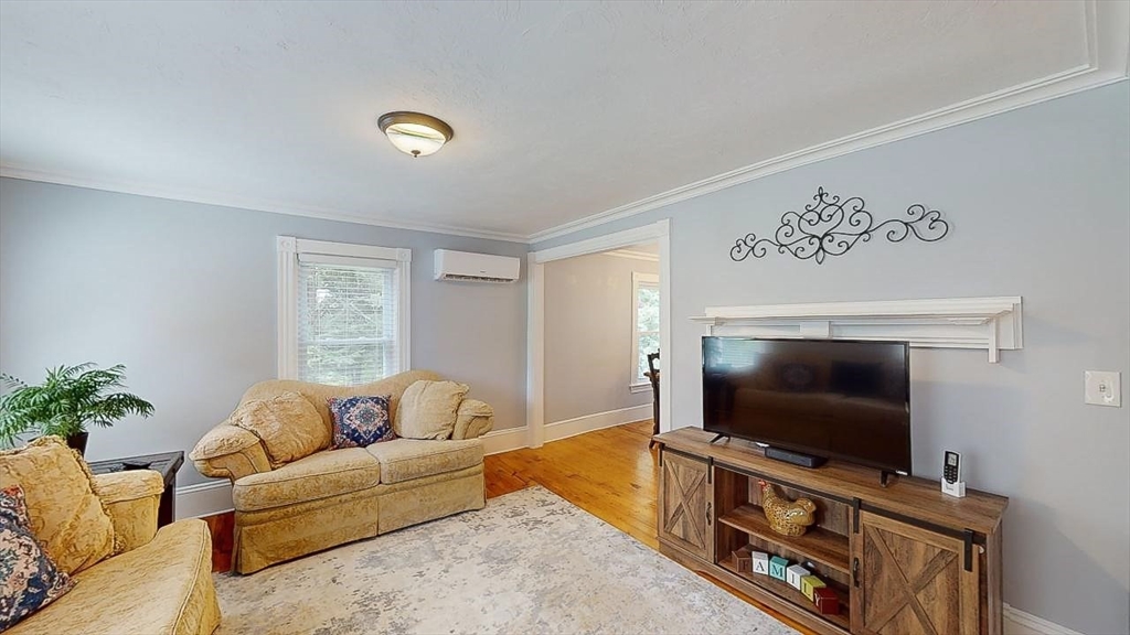 509 Mendon Road Sutton, MA 01590 - Photo 29 of 42 a living room with furniture and a flat screen tv