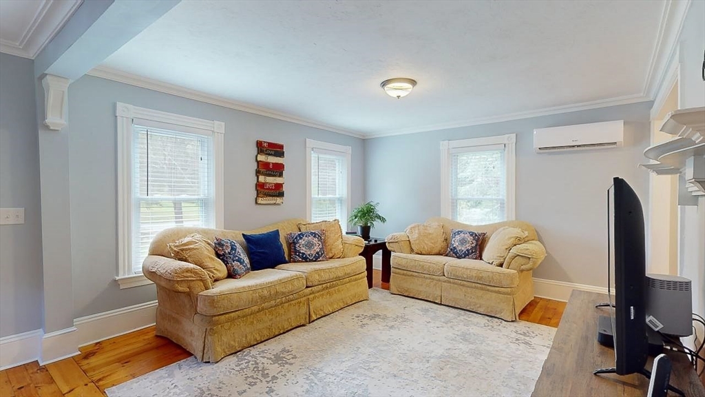 509 Mendon Road Sutton, MA 01590 - Photo 30 of 42 a living room with furniture window and a flat screen tv