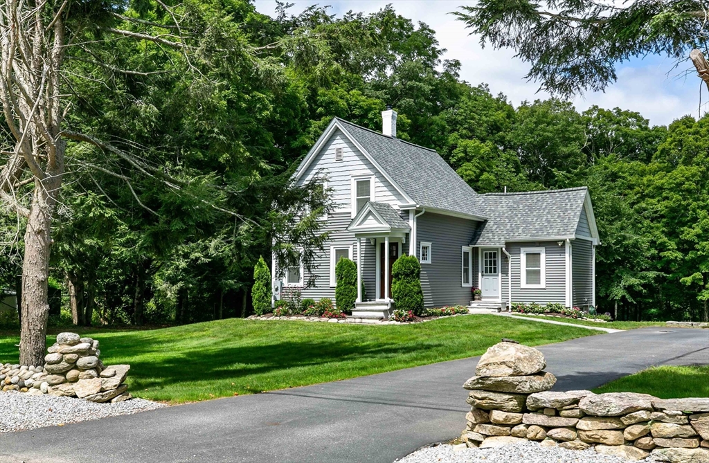 509 Mendon Road Sutton, MA 01590 - Photo 3 of 42 a front view of a house with a yard