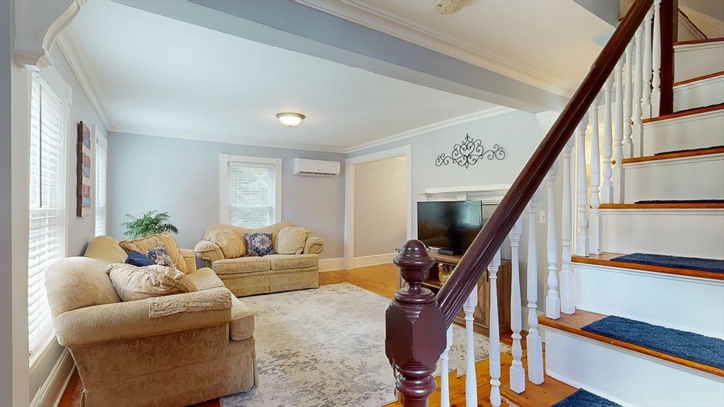 509 Mendon Road Sutton, MA 01590 - Photo 31 of 42 a living room with furniture and stairs