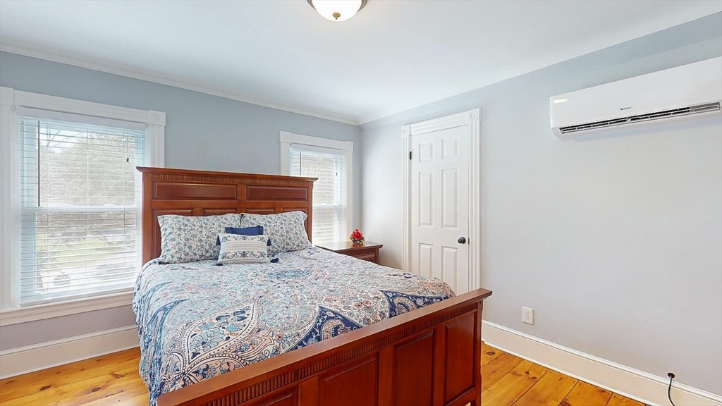 509 Mendon Road Sutton, MA 01590 - Photo 35 of 42 a bed sitting in a bedroom next to a window