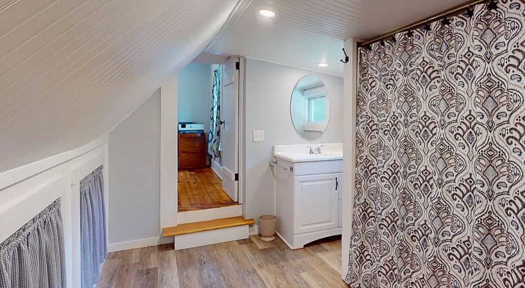 509 Mendon Road Sutton, MA 01590 - Photo 37 of 42 a view of hallway with walk in closet and wooden floor