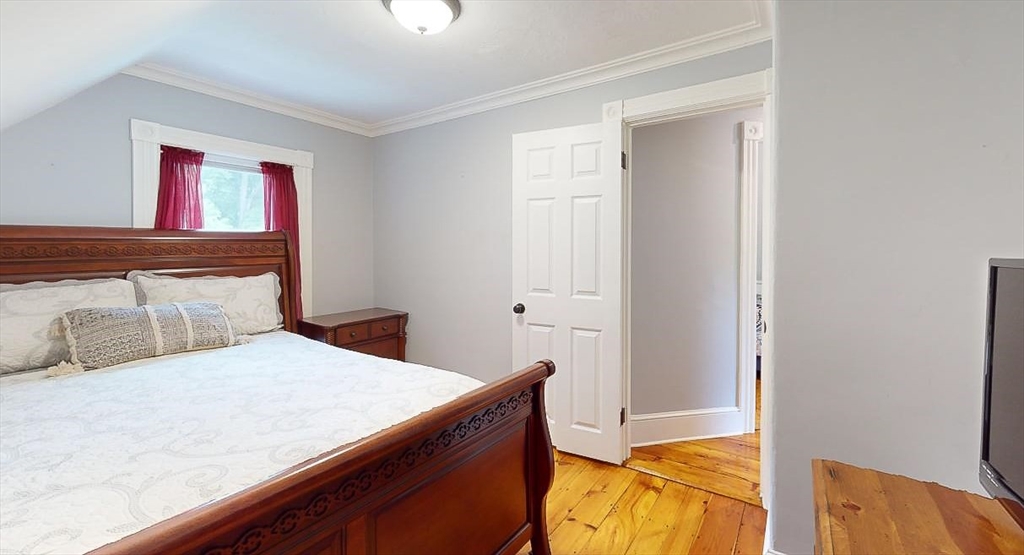 509 Mendon Road Sutton, MA 01590 - Photo 41 of 42 a bedroom with a bed and a cabinets