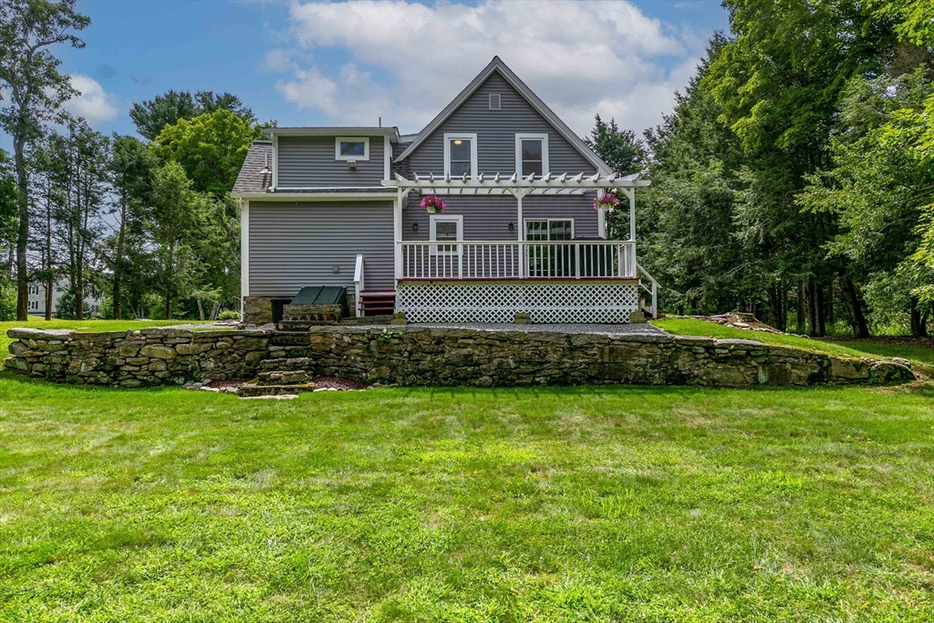 509 Mendon Road Sutton, MA 01590 - Photo 7 of 42 a front view of a house with a yard