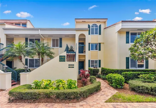 a kitchen with a sink and potted plant