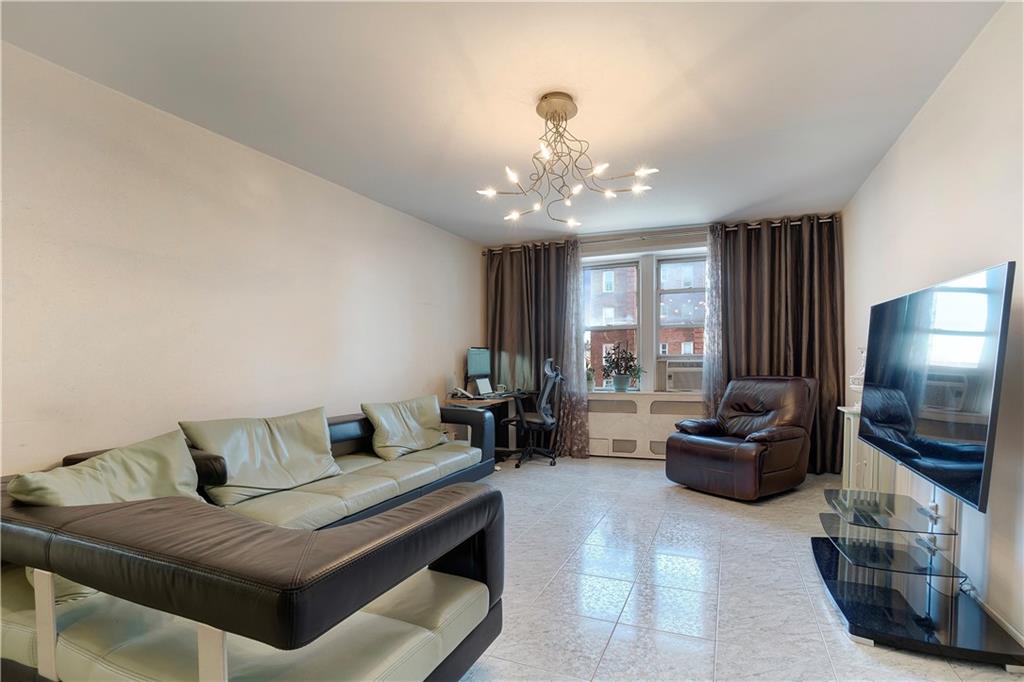 1900 Quentin Road, Unit C4 Brooklyn, NY 11229 - Photo 2 of 13 a living room with furniture and a flat screen tv