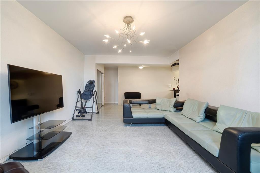1900 Quentin Road, Unit C4 Brooklyn, NY 11229 - Photo 3 of 13 a living room with furniture and a flat screen tv