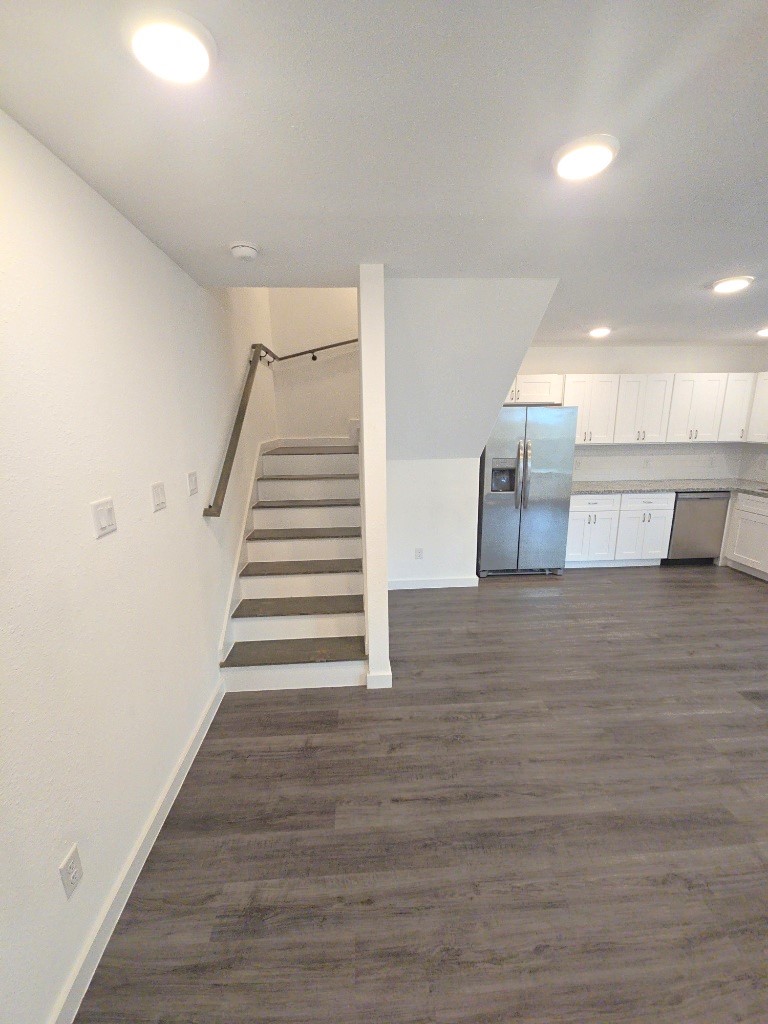 6315 Sandra Street, Unit A Houston, TX 77028 - Photo 12 of 21 a view of a kitchen with wooden floor and stairs