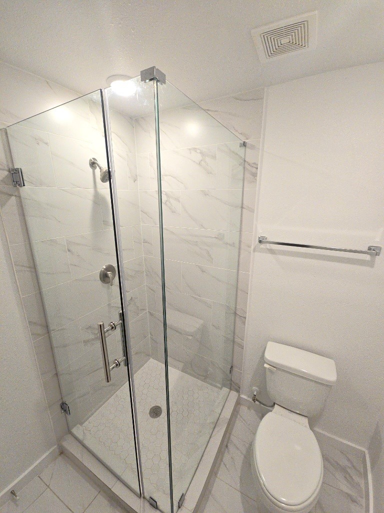 6315 Sandra Street, Unit A Houston, TX 77028 - Photo 15 of 21 a bathroom with a toilet and a shower