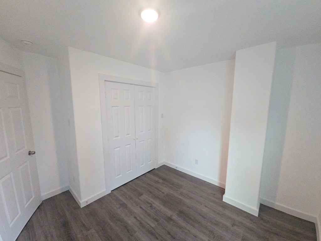 6315 Sandra Street, Unit A Houston, TX 77028 - Photo 8 of 21 a view of an empty room with wooden floor