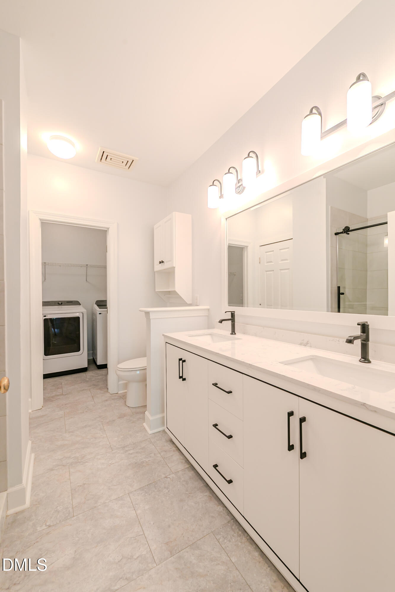 116 Northbrook Drive, Unit 305 Raleigh, NC 27609 - Photo 37 of 43 a bathroom with a granite countertop sink mirror and