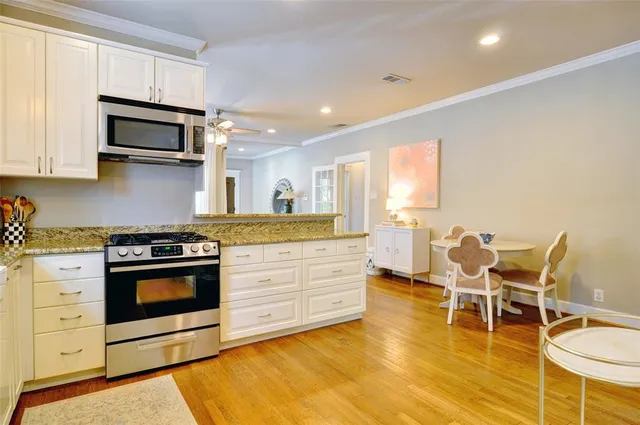 a view of a kitchen cabinets and a wooden floor