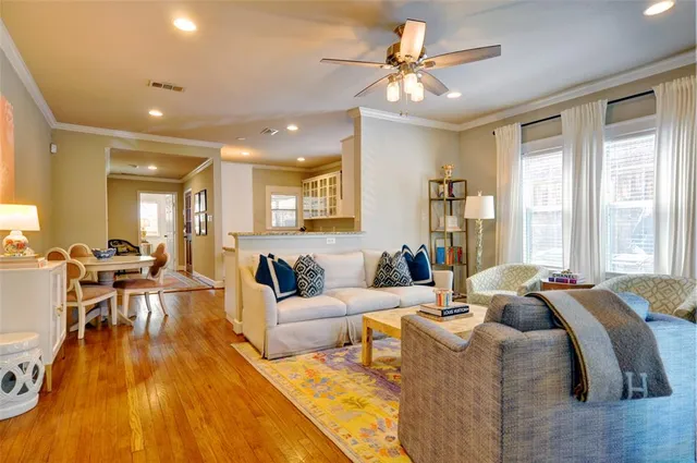 a living room with furniture fireplace and a flat screen tv
