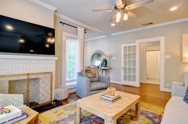 a living room with granite countertop furniture and wooden floor