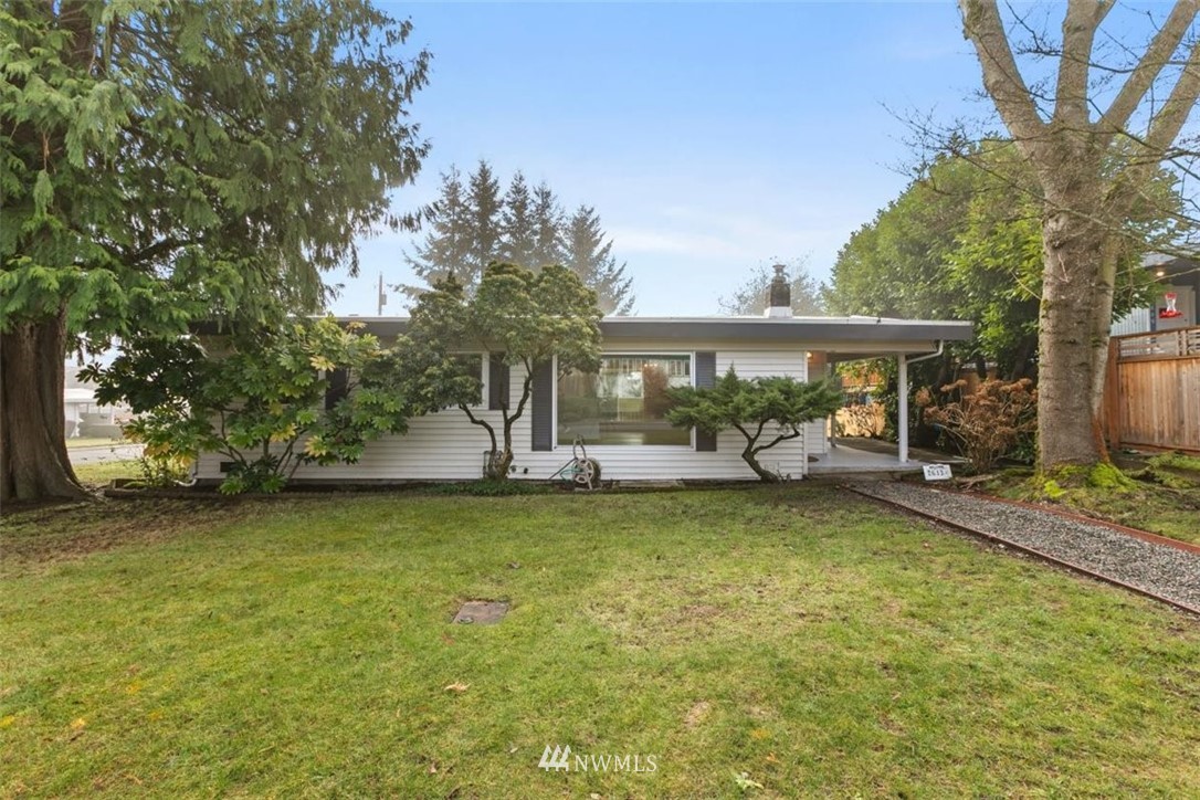 2613 Northeast 6th Place Renton, WA 98056 - Photo 2 of 27 a view of a house with swimming pool and porch