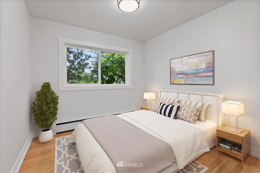 2613 Northeast 6th Place Renton, WA 98056 - Photo 13 of 27 a bedroom with a large bed and a window