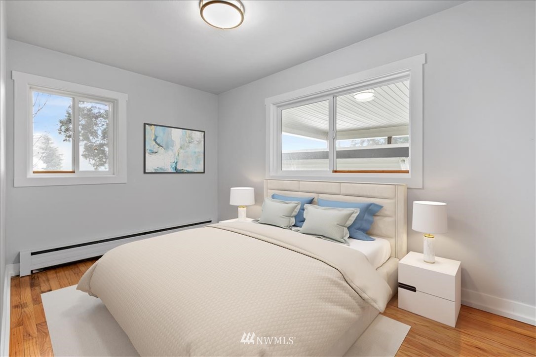 2613 Northeast 6th Place Renton, WA 98056 - Photo 15 of 27 a bedroom with a bed and a window