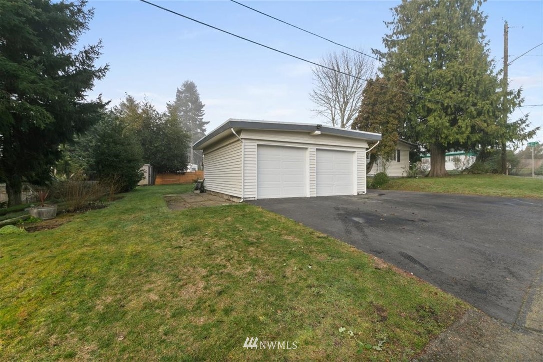 2613 Northeast 6th Place Renton, WA 98056 - Photo 24 of 27 a view of a house with a yard