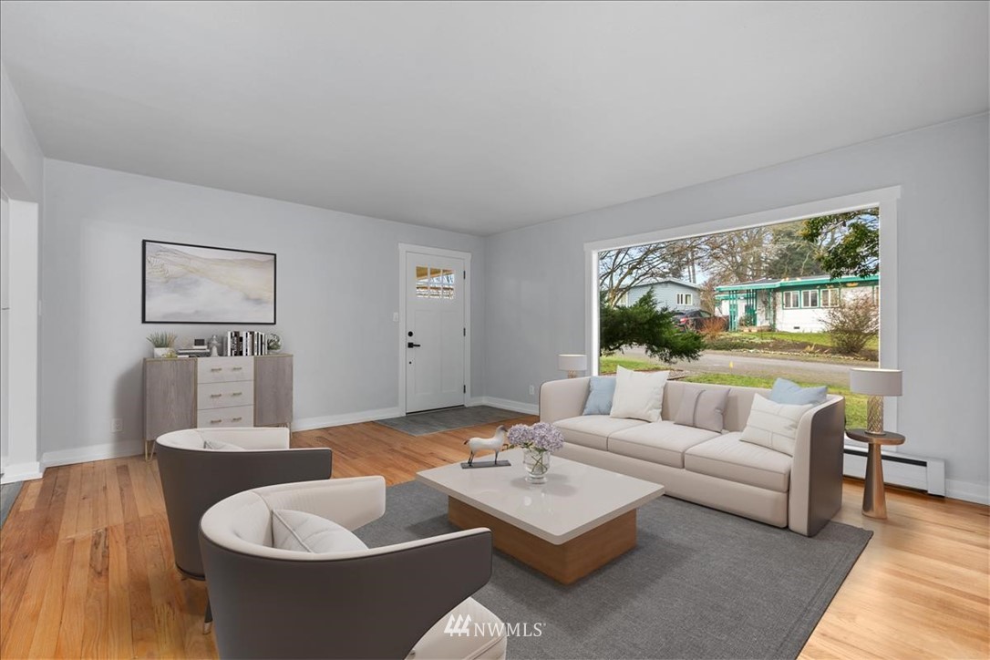 2613 Northeast 6th Place Renton, WA 98056 - Photo 5 of 27 a living room with furniture and a large window
