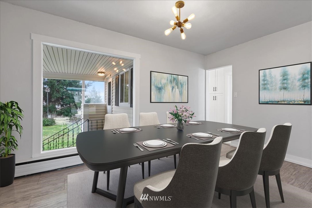 2613 Northeast 6th Place Renton, WA 98056 - Photo 6 of 27 a view of a dining room with furniture window and wooden floor