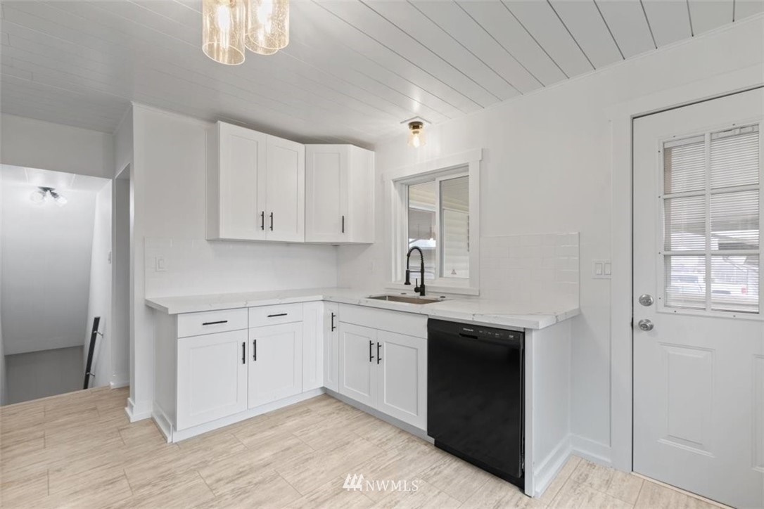 2613 Northeast 6th Place Renton, WA 98056 - Photo 10 of 27 a spacious bathroom with a double vanity sink a and a mirror