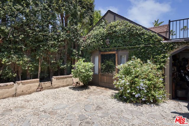 a view of a backyard of the house