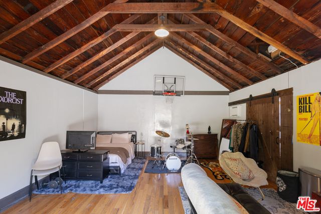 a bedroom with furniture and a chandelier