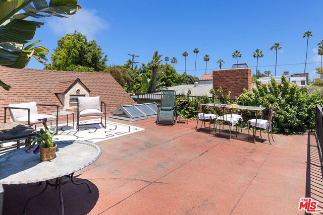 a view of a terrace with sitting area