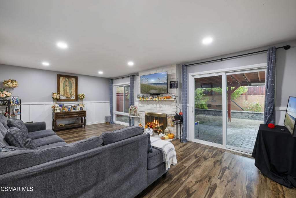 1231 Bluebell Street Oxnard, CA 93036 - Photo 14 of 44 a living room with furniture fireplace and flat screen tv