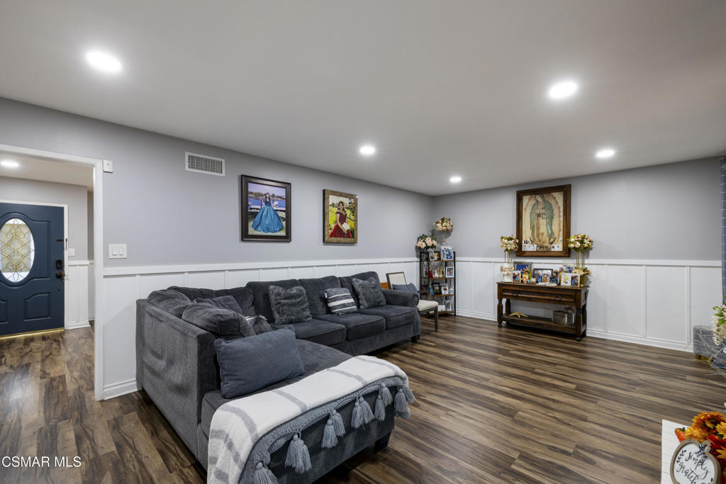 1231 Bluebell Street Oxnard, CA 93036 - Photo 15 of 44 a living room with furniture and a wooden floor